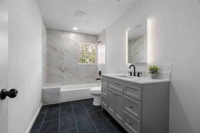 118 Mockingbird Ln, Hillsboro, TX 76645 - bathroom featuring toilet, vanity, shower / bath combination, tile patterned flooring, and baseboards