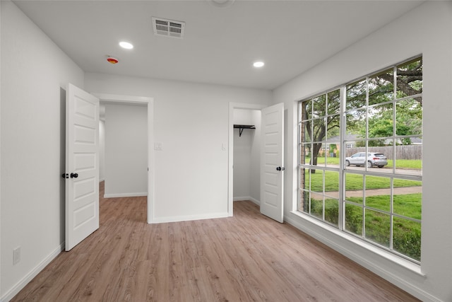 118 Mockingbird Ln, Hillsboro, TX 76645 - unfurnished bedroom with light wood-type flooring, baseboards, and recessed lighting