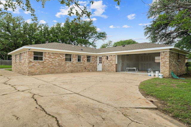 118 Mockingbird Ln, Hillsboro, TX 76645 - back of property featuring brick siding and concrete driveway