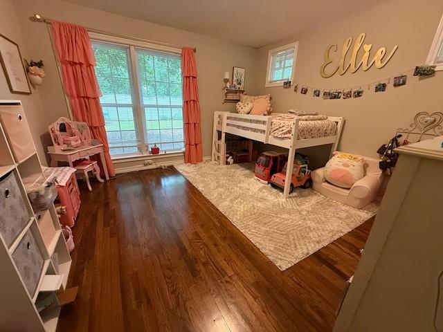 bedroom featuring dark wood-type flooring