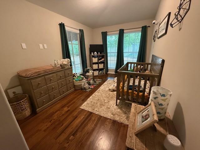 bedroom featuring dark wood-style floors