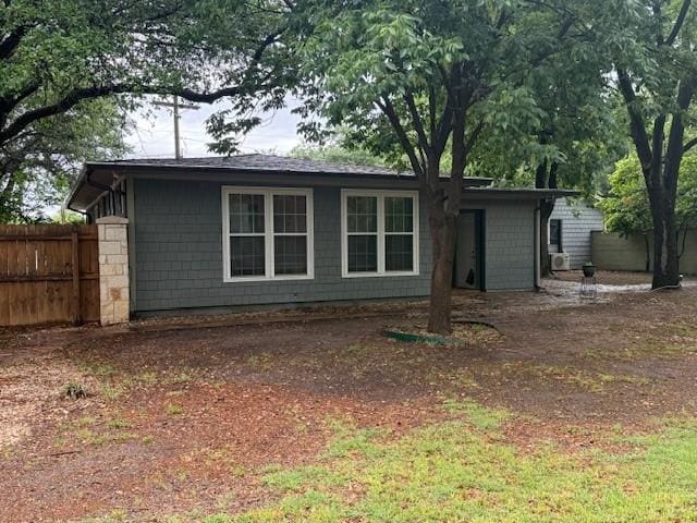 view of front of house featuring fence