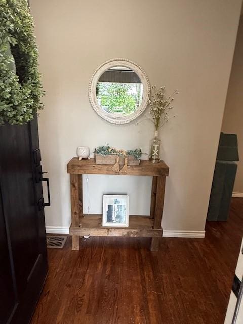 detailed view of baseboards and wood finished floors