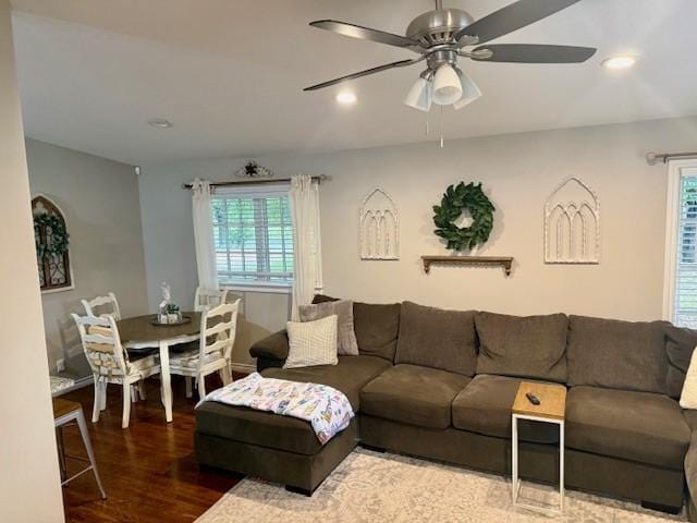 living room featuring wood finished floors, a ceiling fan, and recessed lighting