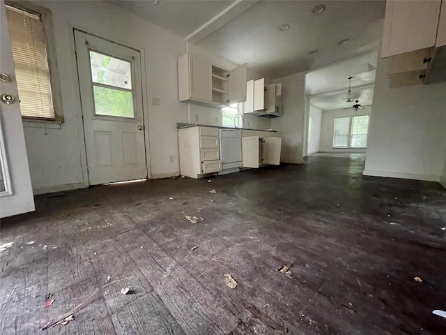 kitchen featuring white cabinets, white dishwasher, a ceiling fan, baseboards, and open shelves