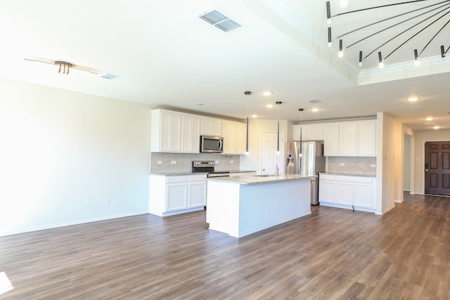 kitchen with appliances with stainless steel finishes, dark wood-type flooring, recessed lighting, tasteful backsplash, and a sink