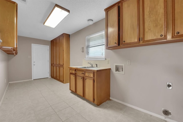 23010 County Road 3313, Chandler, TX 75758 - laundry area with hookup for a washing machine, hookup for an electric dryer, baseboards, and cabinet space