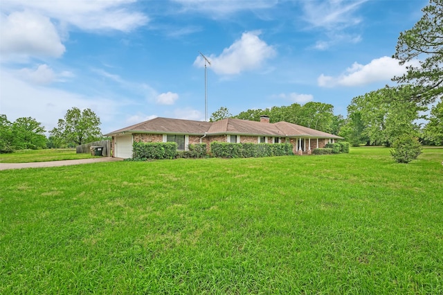 23010 County Road 3313, Chandler, TX 75758 - ranch-style house featuring a front lawn, a chimney, concrete driveway, an attached garage, and brick siding