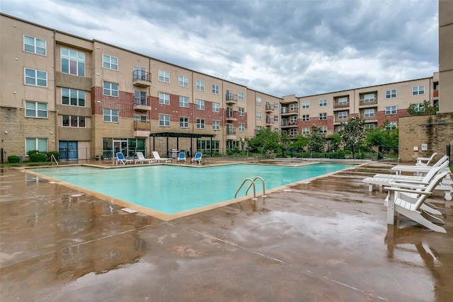 community pool featuring a patio area