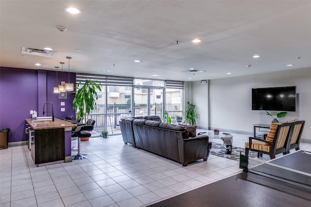 building lobby featuring a sink and recessed lighting