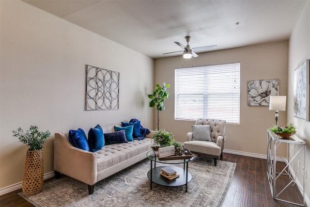 living area featuring ceiling fan, dark wood finished floors, and baseboards