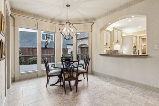 5957 Aberdeen Pl, Frisco, TX 75034 - dining area featuring ornamental molding, a chandelier, light tile patterned floors, arched walkways, and recessed lighting