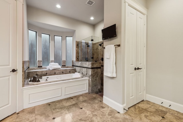 5957 Aberdeen Pl, Frisco, TX 75034 - full bathroom with a walk in shower, a garden tub, recessed lighting, and baseboards