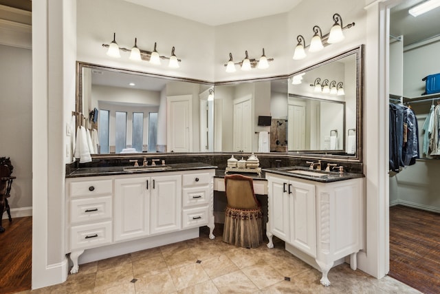 5957 Aberdeen Pl, Frisco, TX 75034 - bathroom featuring vanity and a spacious closet