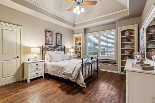 5957 Aberdeen Pl, Frisco, TX 75034 - bedroom featuring dark wood-style flooring, a raised ceiling, and a ceiling fan
