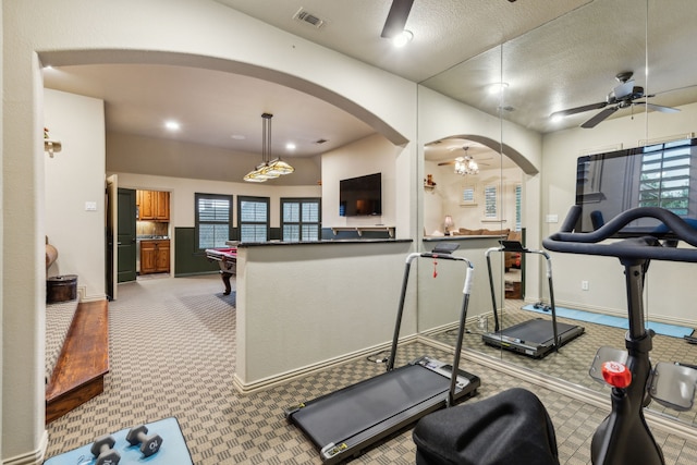 5957 Aberdeen Pl, Frisco, TX 75034 - exercise room featuring arched walkways, billiards, light colored carpet, a textured ceiling, and recessed lighting