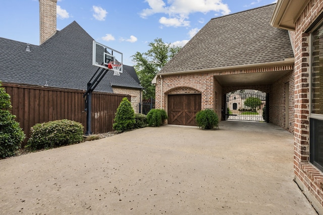 5957 Aberdeen Pl, Frisco, TX 75034 - view of patio featuring fence, driveway, and a garage