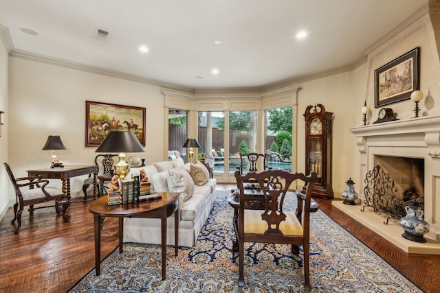 5957 Aberdeen Pl, Frisco, TX 75034 - living room with wood finished floors, a large fireplace, baseboards, crown molding, and recessed lighting