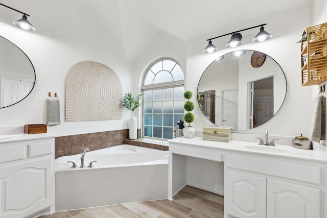 9529 Cholla Cactus Trl, Fort Worth, TX 76177 - full bath with a garden tub, wood finished floors, vanity, and vaulted ceiling
