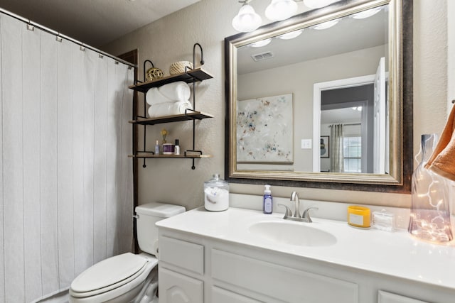 9529 Cholla Cactus Trl, Fort Worth, TX 76177 - full bathroom featuring a textured wall, vanity, and toilet