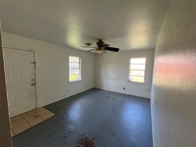 604 E 5th St, Weatherford, TX 76086 - bathroom featuring a textured ceiling, toilet, a wainscoted wall, tile walls, and vanity