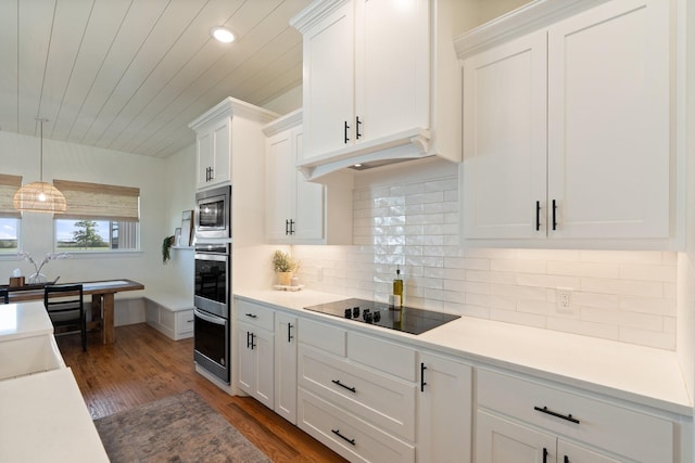109 Old Decatur Rd, Decatur, TX 76234 - kitchen with stainless steel appliances, white cabinets, light countertops, recessed lighting, and wooden ceiling