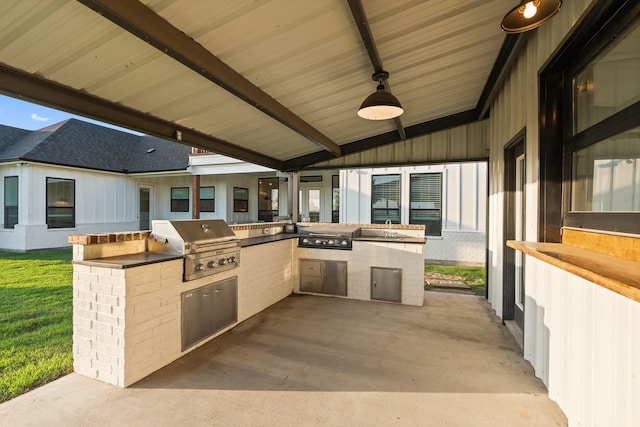 109 Old Decatur Rd, Decatur, TX 76234 - view of patio featuring a grill, exterior kitchen, a ceiling fan, and a sink