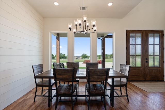 109 Old Decatur Rd, Decatur, TX 76234 - dining area featuring a chandelier, french doors, dark wood finished floors, recessed lighting, and wooden walls