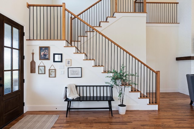 109 Old Decatur Rd, Decatur, TX 76234 - entrance foyer with stairs, wood finished floors, baseboards, and a towering ceiling