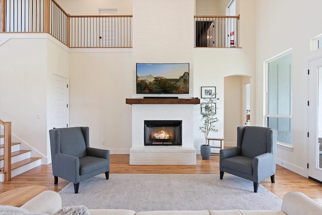 109 Old Decatur Rd, Decatur, TX 76234 - living room featuring a high ceiling, wood finished floors, and arched walkways