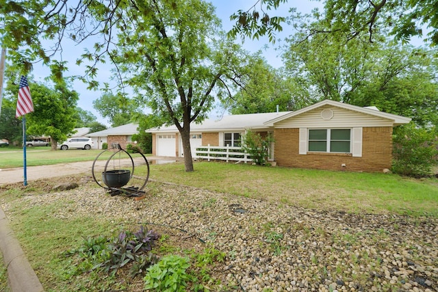 ranch-style home with brick siding and a garage