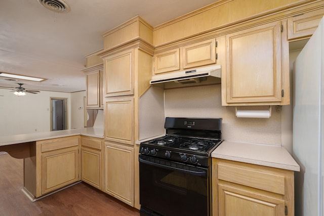 kitchen featuring black gas range, under cabinet range hood, a peninsula, light brown cabinetry, and light countertops