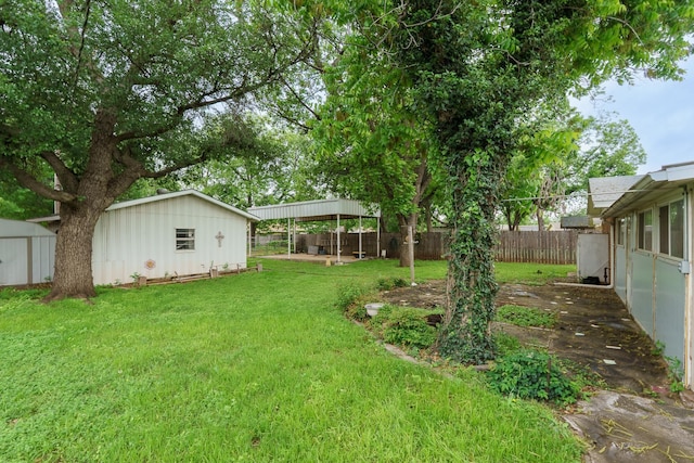 view of yard with an outdoor structure and a storage shed