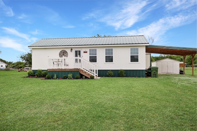 7265 Guadalupe Trl, Weatherford, TX 76087 - view of front of home featuring a front yard, an outbuilding, metal roof, a storage unit, and a carport