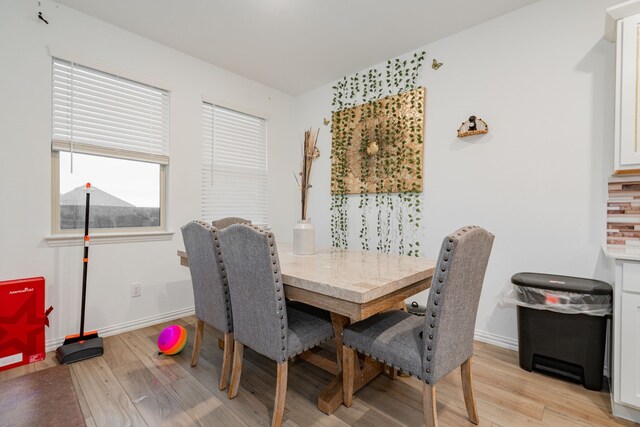 1034 Manuel Dr, Fate, TX 75087 - dining space with light wood-type flooring and baseboards