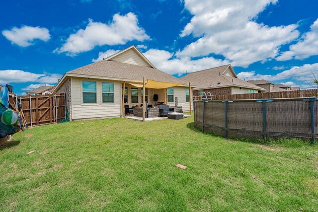 1034 Manuel Dr, Fate, TX 75087 - rear view of house with an outdoor living space and a patio area