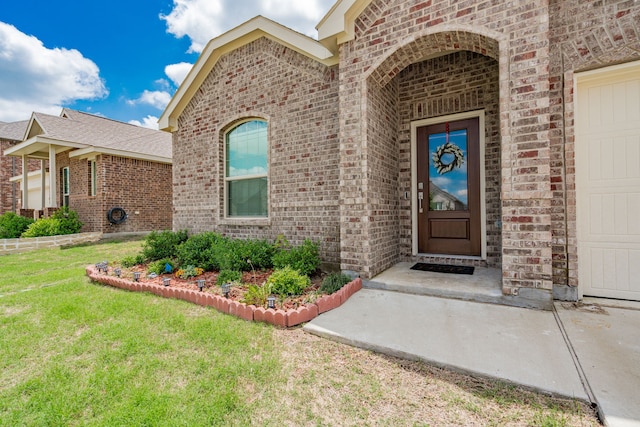 1034 Manuel Dr, Fate, TX 75087 - doorway to property with brick siding and a yard