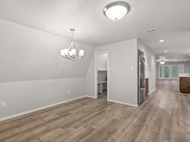 additional living space with a chandelier, light wood-style flooring, baseboards, ceiling fan, and recessed lighting