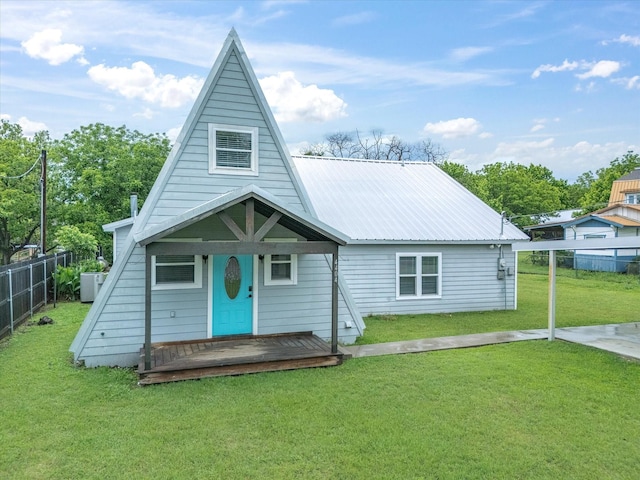 view of front of property with central air condition unit and metal roof