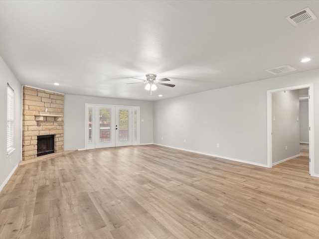 unfurnished living room with ceiling fan, baseboards, light wood-style floors, and recessed lighting