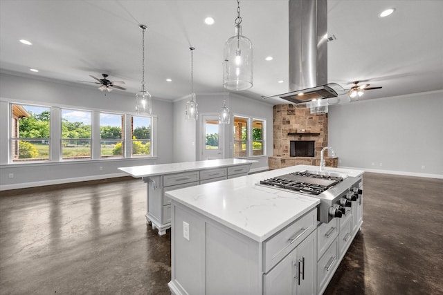 2730 Bryson Rd, Mansfield, TX 76063 - kitchen with open floor plan, ceiling fan, an island with sink, stainless steel gas cooktop, and finished concrete flooring