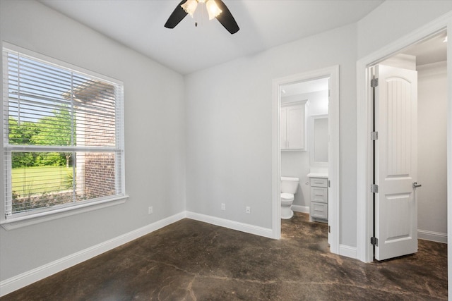 2730 Bryson Rd, Mansfield, TX 76063 - unfurnished bedroom featuring unfinished concrete flooring, ensuite bath, baseboards, and a ceiling fan