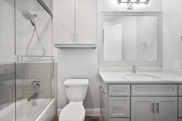 2730 Bryson Rd, Mansfield, TX 76063 - bathroom featuring vanity, toilet, enclosed tub / shower combo, and baseboards