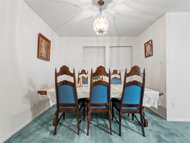 dining area featuring a chandelier, carpet flooring, a textured ceiling, and baseboards