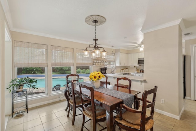 5008 Caliente Dr, Arlington, TX 76017 - dining area with crown molding, healthy amount of natural light, light tile patterned flooring, baseboards, and a ceiling fan