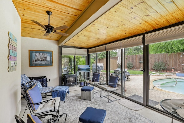 5008 Caliente Dr, Arlington, TX 76017 - sunroom / solarium featuring a wood stove and a jacuzzi