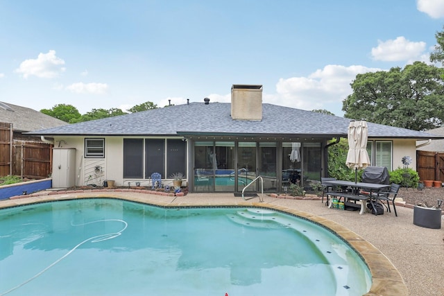 5008 Caliente Dr, Arlington, TX 76017 - view of pool with fence, a patio, and a sunroom