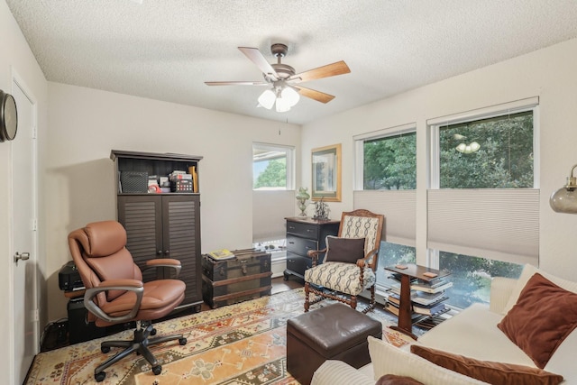 5008 Caliente Dr, Arlington, TX 76017 - living area featuring ceiling fan, a textured ceiling, and an office area