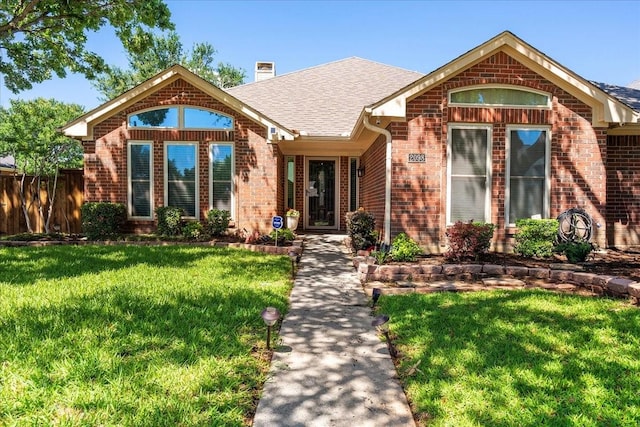 2098 Amber Ct, Lewisville, TX 75067 - ranch-style house with brick siding, a chimney, and roof with shingles