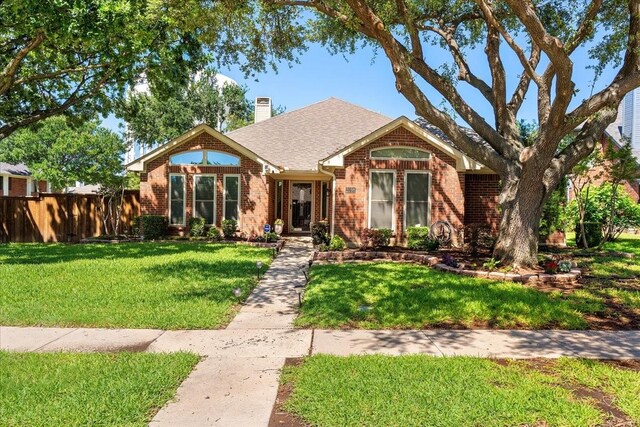 2098 Amber Ct, Lewisville, TX 75067 - ranch-style home with brick siding, a chimney, and roof with shingles